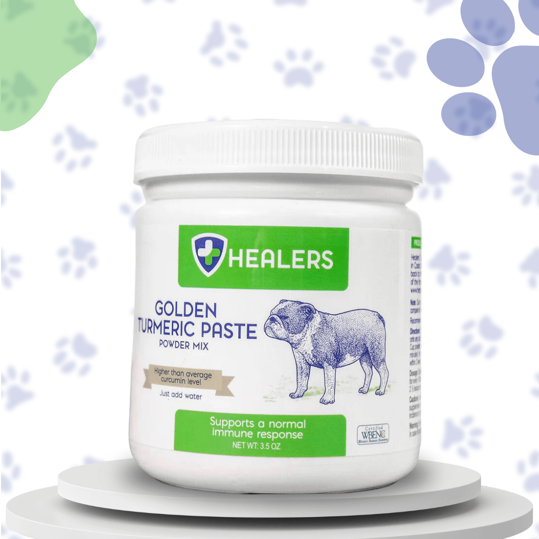 White jar of Healers Golden Turmeric Paste powder mix. Label shows a bulldog and text about immune support. Light background with blue and green paw print pattern.