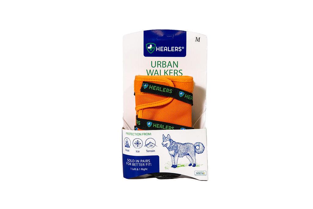 Healers Urban Walkers dog boots in orange packaging, designed to protect paws from heat, ice, and rough terrain, sold in pairs for left and right paws