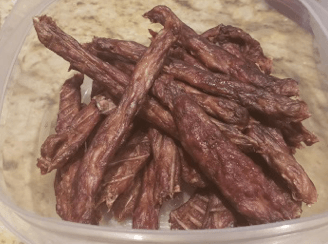 Homemade beef and chicken jerky dog treats made with Healers Hip & Joint powder and Golden Turmeric Paste for a healthy, natural dog snack