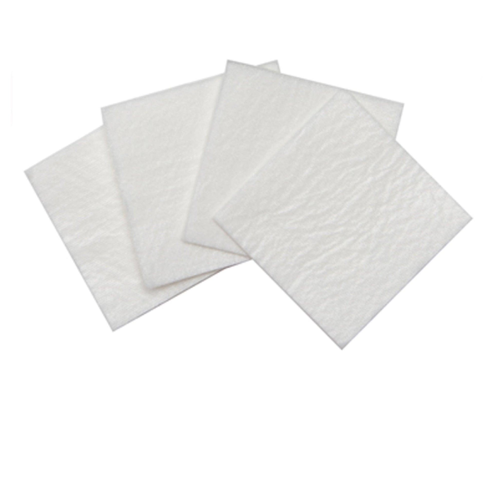 Close-up of four white, soft-looking Healers gauze pads, square, arranged in a small stack. Plain white background.